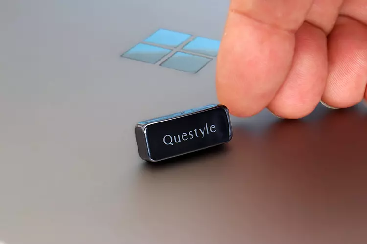 Questyle QCC Dongle Pro beside a finger