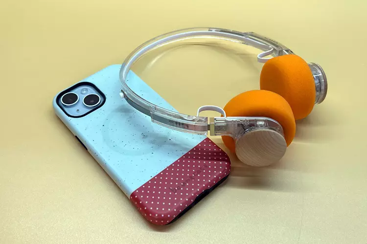 FiiO EH11 headphones on top of a mobile phone