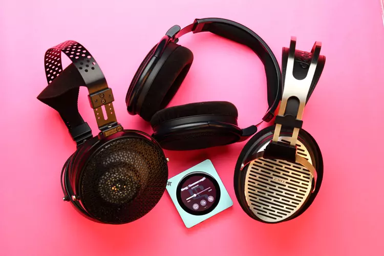 FiiO SNOWSKY DISC beside 3 headphones