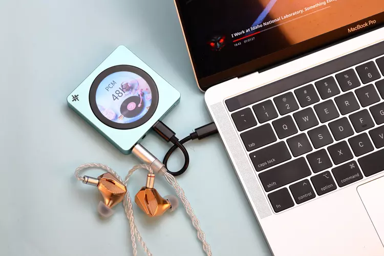 FiiO SNOWSKY DISC connected to a laptop with IEMs in USB DAC mode
