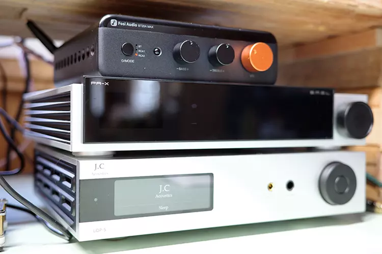 Fosi Audio BT20A MAX on top of two amplifiers