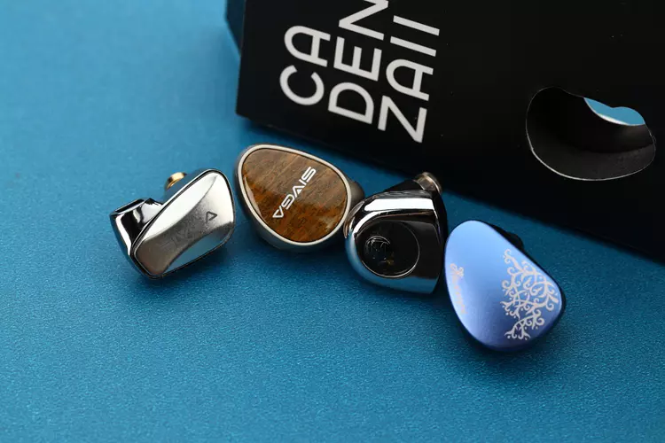 Kiwi Ears Cadenza II beside 3 other IEMs