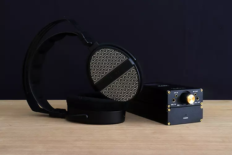 THIEAUDIO Cypher beside a portable amplifier