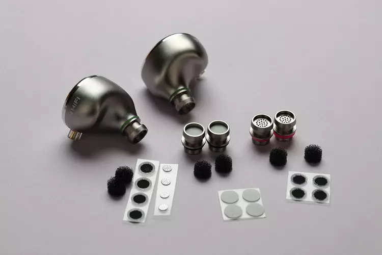 TinHiFi T6 shells beside its tuning filters