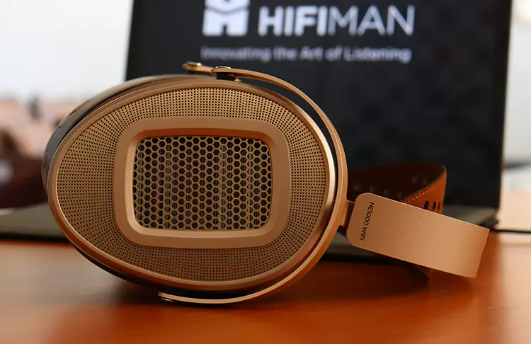 HIFIMAN HE1000 WiFi headphones in front of its retail box