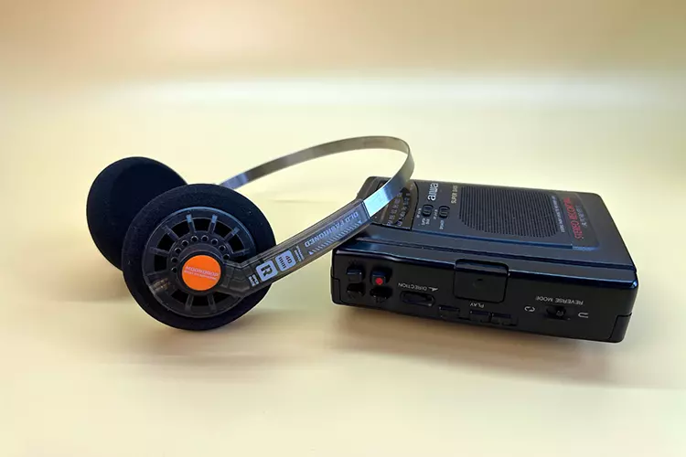 MOONDROP Old Fashioned headphones beside a WALKMAN