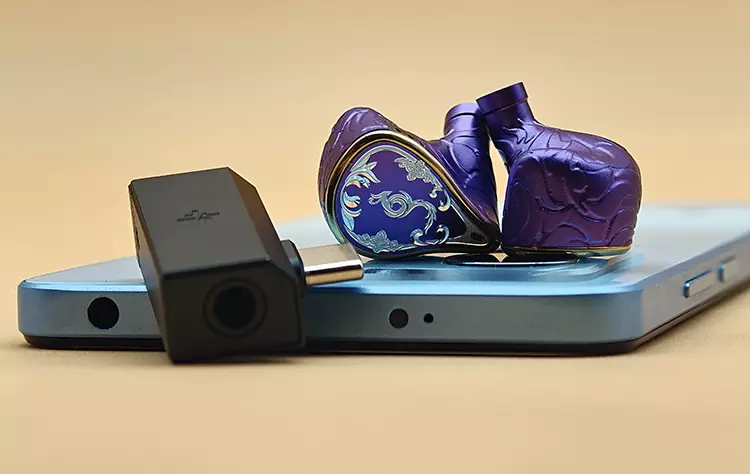 EPZ 550 on to of blue smartphone with FiiO SNOWSKY Tiny