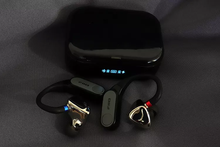 FiiO LINK TWS beside closed charging cradle