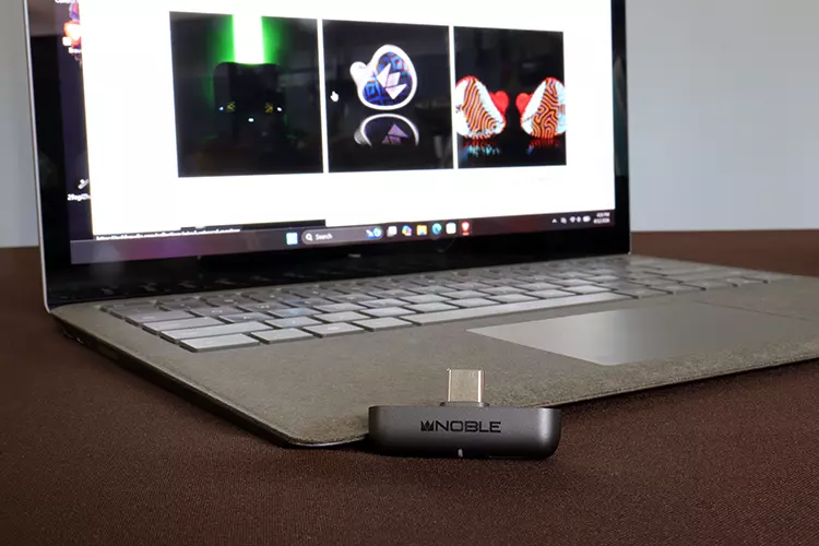 Noble Audio Sceptre beside a laptop