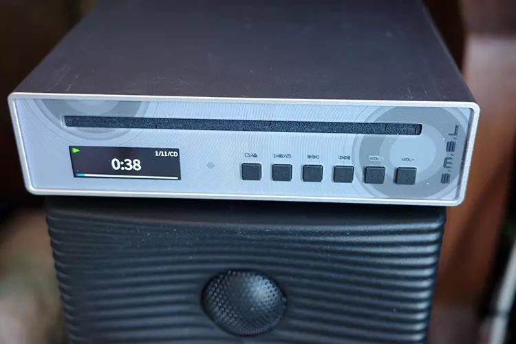 SMSL PL100PRO CD player on top of a black speaker