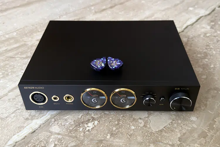Sendy Audio KYLIN amplifier with IEMs on top