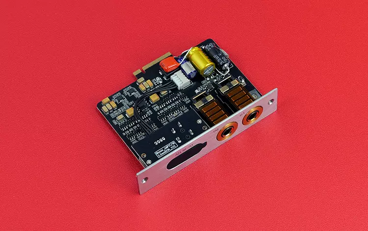 iBasso AMP18 card laying flat on a red background