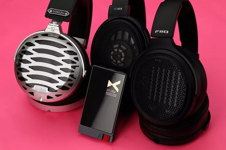 xDuoo XP-2 Bal beside 3 headphones