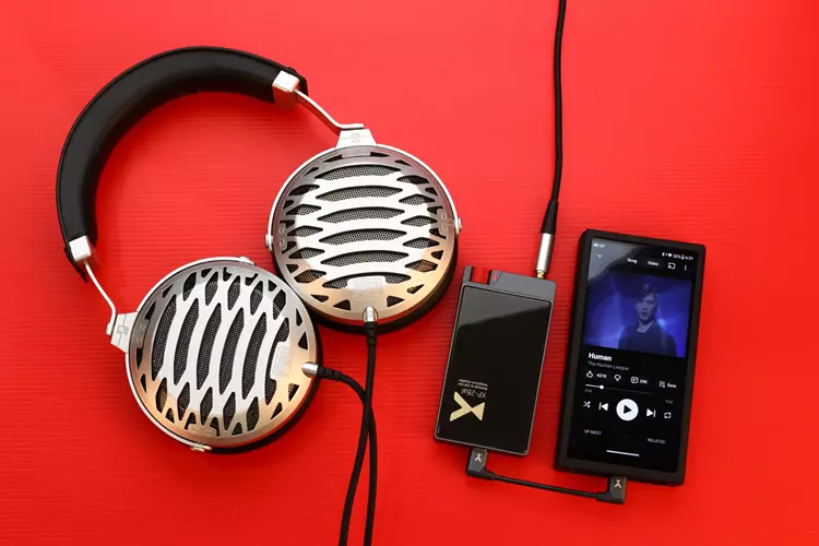 xDuoo XP-2 Bal beside headphones and a DAP