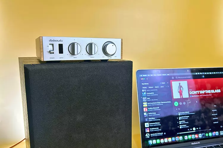 FiiO Jade Audio Level 1 amplifier on top of a speaker