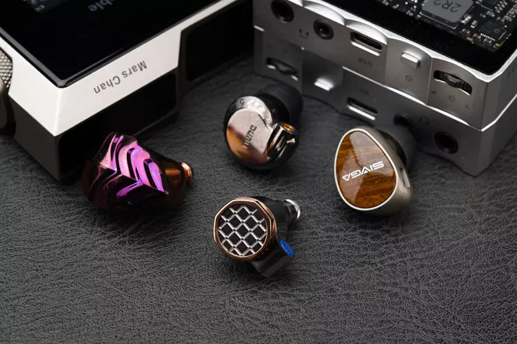 FiiO SNOWSKY OAK NANO bshell beside 3 other IEM shells