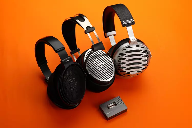 MUSE HiFi M3 Ultra amplifier beside 3 headphones
