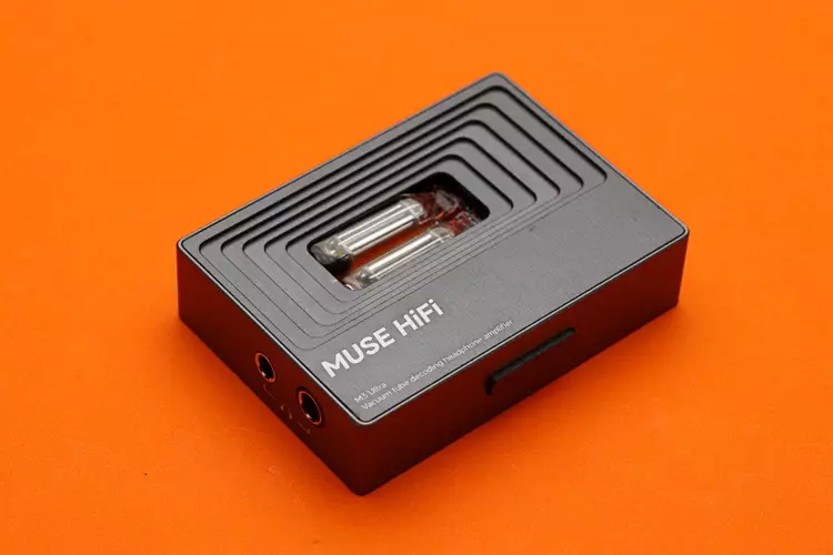 MUSE HiFi M3 Ultra amplifier on orange background