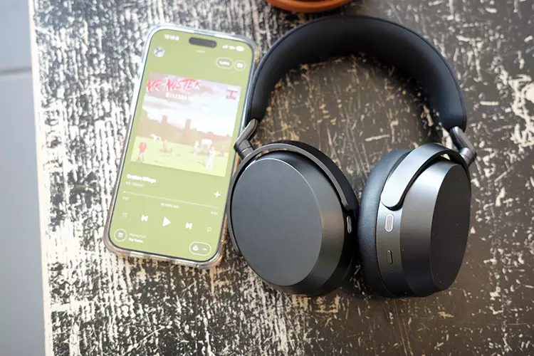 Sennheiser MOMENTUM 5 Wireless Review beside a phone