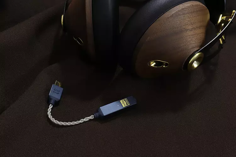 iFi audio GO Link 2 beside Meze Audio 99 Classic 2nd Gen headphones