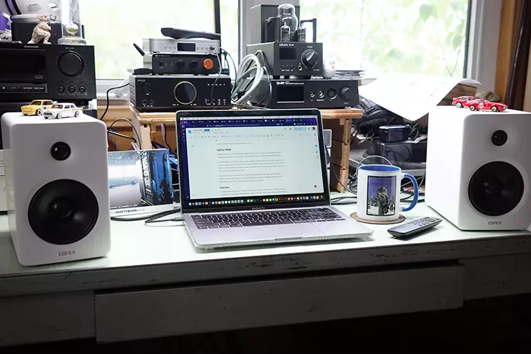 Edifier M90 on a desktop with a laptop in the middle