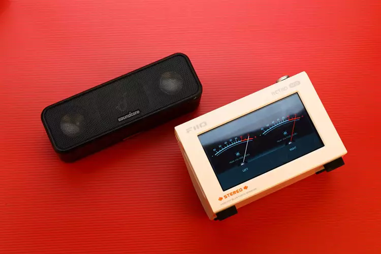FiiO RETRO BOX beside Soundcore speaker