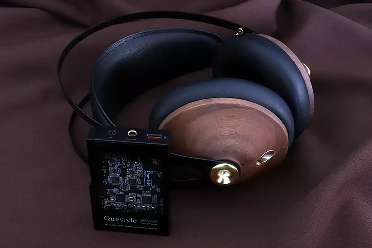 Questyle M18i Max beside the Meze Audio 99 Classics Gen 2 headphones